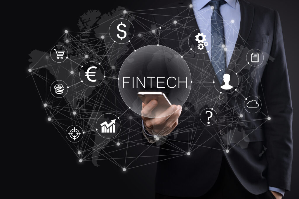 businessman hold fintech financial technology concept.business investment banking payment. cryptocurrency investment and digital money. business concept on virtual screen.